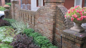 A lovely brick home with a charming garden.