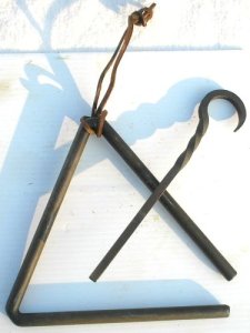 Forged metal triangle I ordered via Amazon. http://www.amazon.com/dp/B002YAZ2Q6/ref=pe_385040_30332190_TE_3p_M3T1_ST1_dp_1