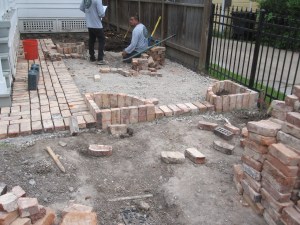 Working out the design in the small brick patio.