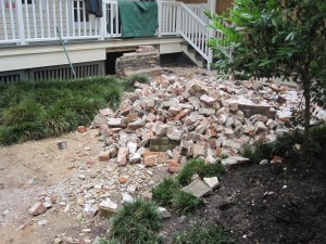 As they broke down the planter the lower bricks began to crumble.