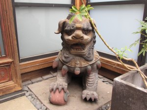 Her partner. YOu can tell he is the male because he has a ball under his foot.