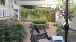 Here is the planter which takes up a lot of space and to the left is an old brick stair that goes to no where.