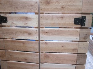 Cedar gate and A/C surround. Designed and constructed by Ravenscourt Landscaping & Design LLC