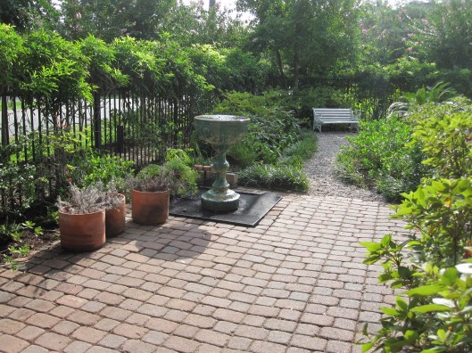 The fountain is centered on their front door and just waiting for new rocks to hide the basin. 