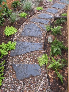 Blue gray flagstone and rainbow gravel path. 