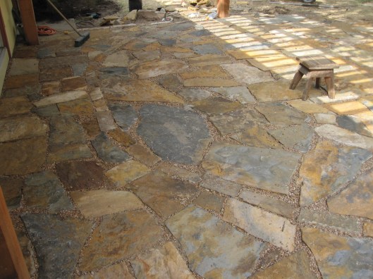 Brushing in pea gravel. 