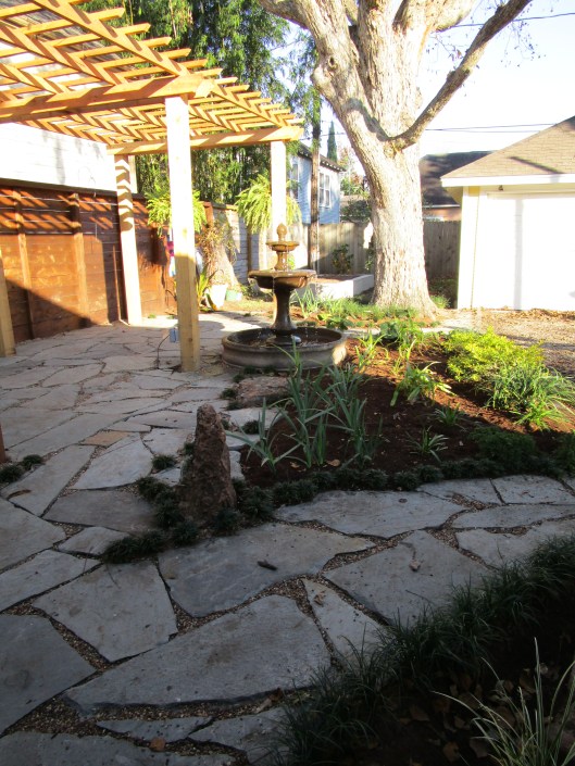 pergola and flagstone patio and paths