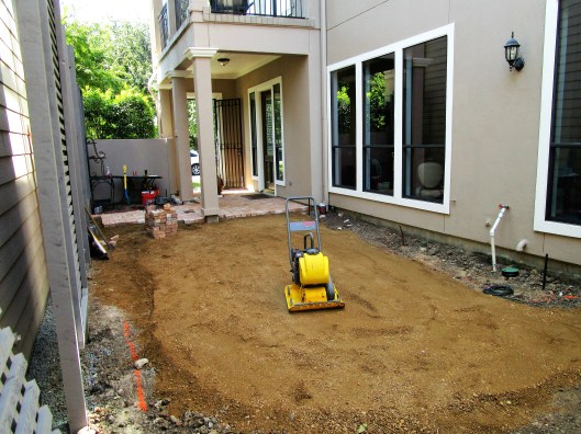 Compacting decomposed granite.