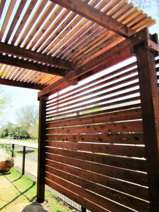 Privacy wall on a pergola