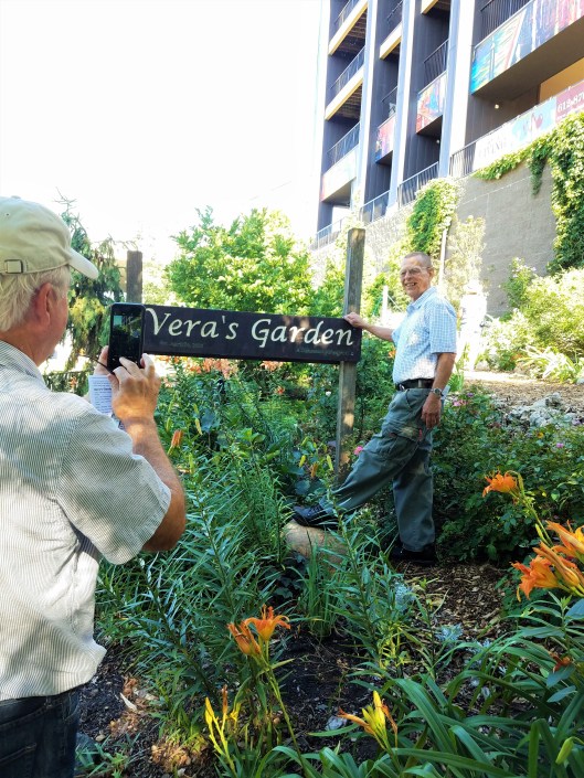 Jim Peterson publisher of Garden Design Magazine take a photo of Designer Donovan Harmel at Vera's Garden.